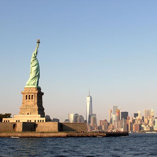 Statue of Liberty with New York skyline in the background.